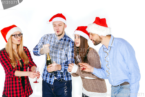 Image of Many young women and men drinking at christmas party