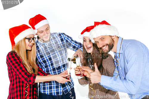 Image of Many young women and men drinking at christmas party