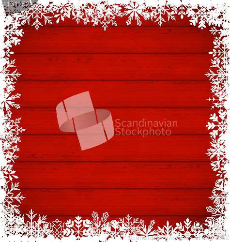 Image of Christmas snowflakes border on wooden background