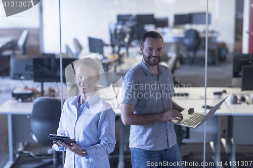 Image of business couple at office