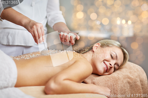 Image of close up of woman lying and having massage in spa