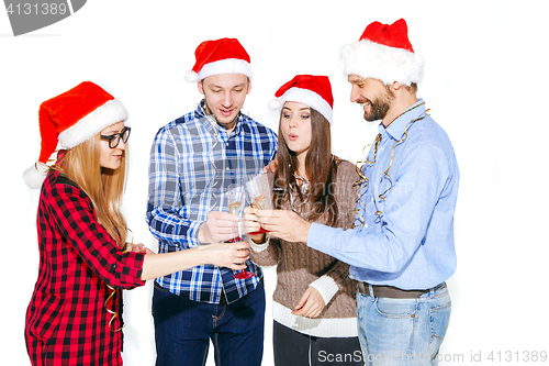 Image of Many young women and men drinking at christmas party