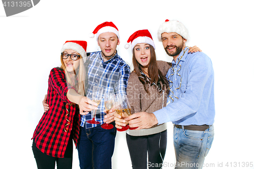 Image of Many young women and men drinking at christmas party