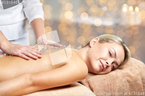 Image of close up of woman lying and having massage in spa