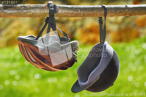 Image of Jockey Helmets on the Rail