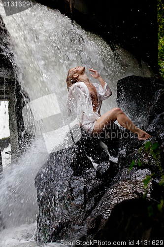 Image of Young Woman Near The Waterfall