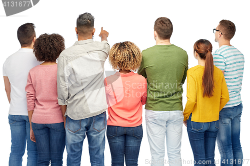 Image of group of people pointing to something