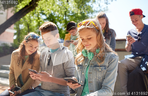 Image of teenage friends with smartphone and headphones