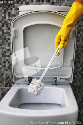 Image of cleaning of white toilet bowl 