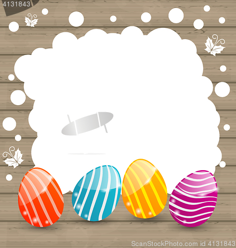 Image of Holiday card with Easter colorful eggs on wooden background