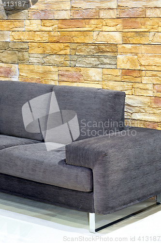 Image of Sofa over stones