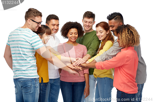 Image of international group of happy people holding hands