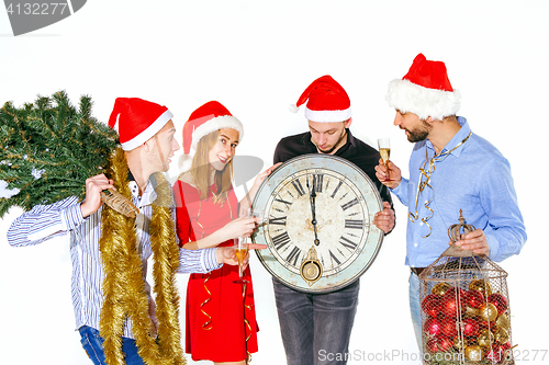 Image of Many young women and men drinking at christmas party