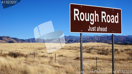 Image of Rough Road brown road sign