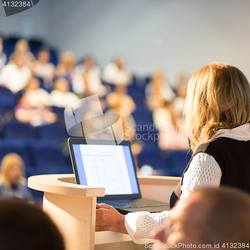 Image of Speaker at Business Conference and Presentation.