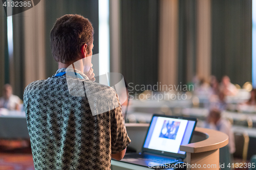 Image of Public speaker giving talk at scientific conference.