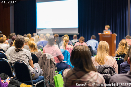 Image of Audience in lecture hall participating at business event.