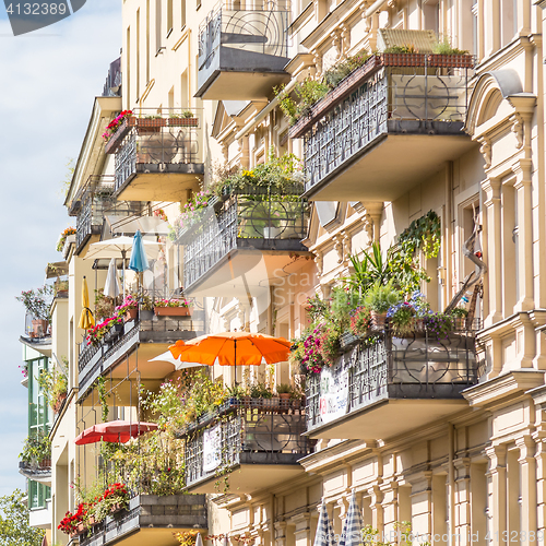 Image of Traditional European Balcony with colorful flowers and flowerpots.