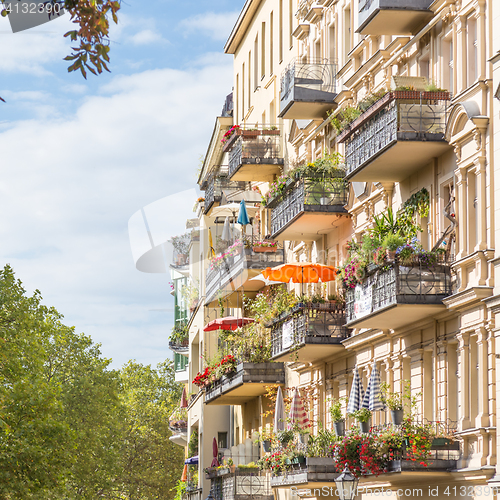 Image of Traditional European Balcony with colorful flowers and flowerpots.