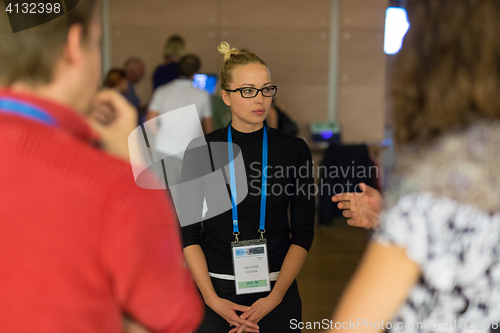 Image of People interacting during coffee break at medical conference.