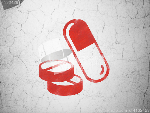 Image of Medicine concept: Pills on wall background