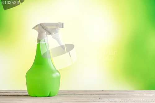 Image of Spray can on a wooden table