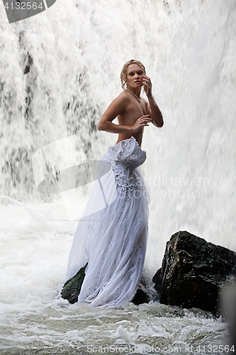 Image of Young Topless Woman In A River