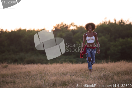 Image of young black woman in nature