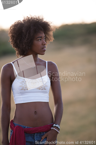 Image of young black woman in nature