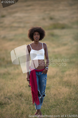 Image of young black woman in nature