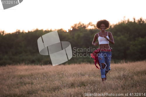 Image of young black woman in nature