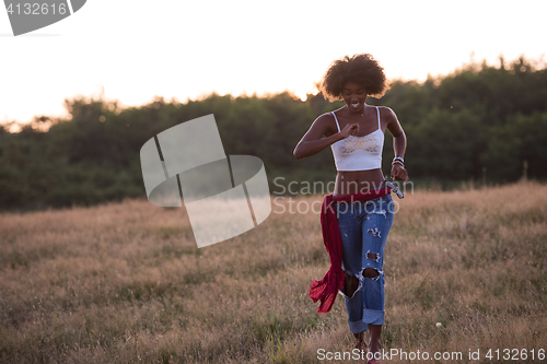 Image of young black woman in nature