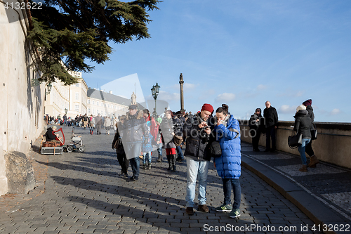 Image of Tourists queue in front of the Prague Castle