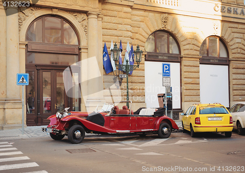 Image of Famous historic red car Praga in Prague street