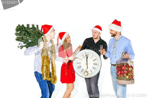 Image of Many young women and men drinking at christmas party