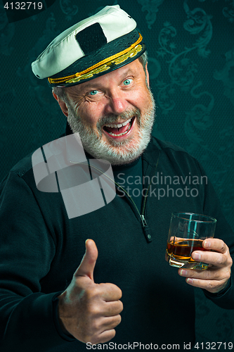 Image of Portrait of old captain or sailor man in black sweater