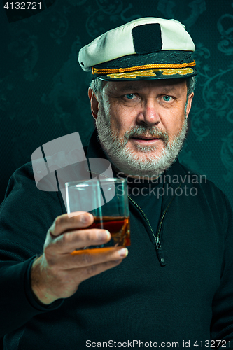 Image of Portrait of old captain or sailor man in black sweater