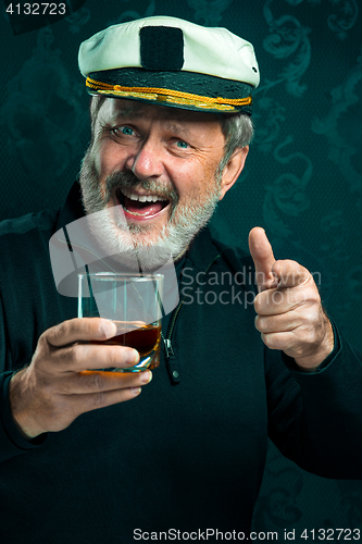 Image of Portrait of old captain or sailor man in black sweater