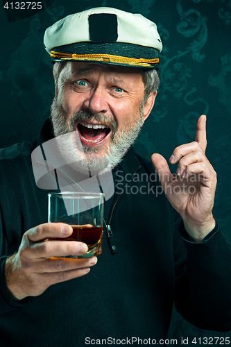 Image of Portrait of old captain or sailor man in black sweater