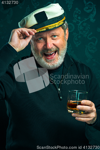 Image of Portrait of old captain or sailor man in black sweater