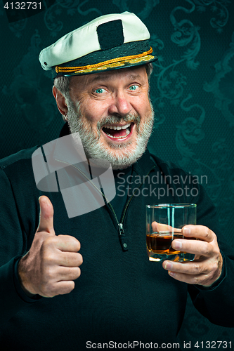 Image of Portrait of old captain or sailor man in black sweater