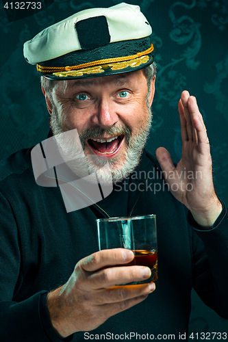 Image of Portrait of old captain or sailor man in black sweater