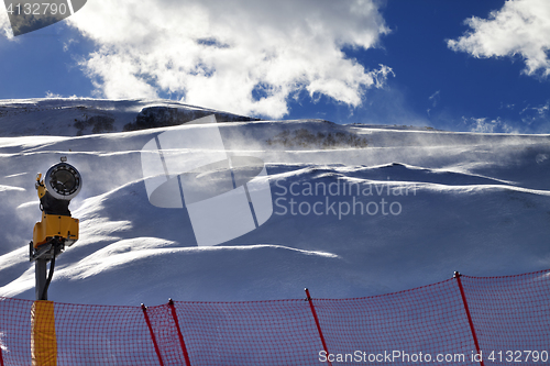 Image of Off-piste slope during blizzard and sunlight blue sky with cloud