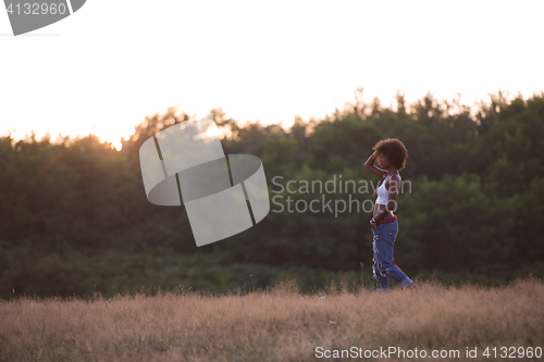 Image of young black woman in nature