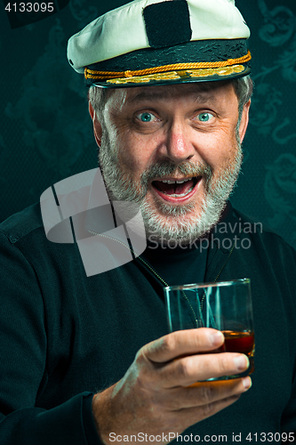 Image of Portrait of old captain or sailor man in black sweater