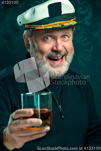 Image of Portrait of old captain or sailor man in black sweater