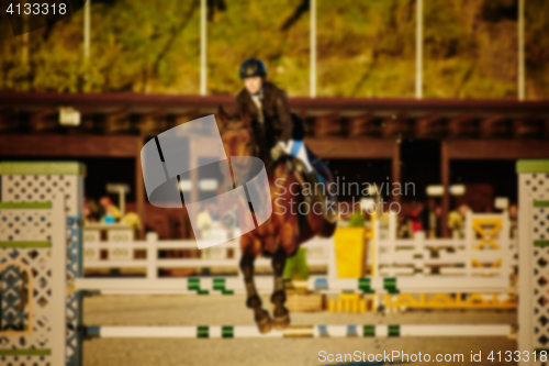 Image of Equestrian Sports. Horse Jumping. Show. Photo blurred on purpose