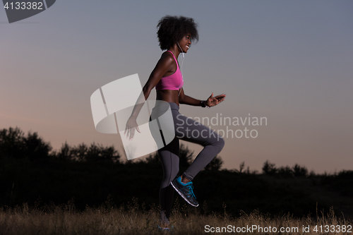 Image of black woman is doing stretching exercise relaxing and warm up