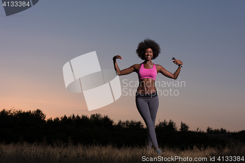 Image of black woman is doing stretching exercise relaxing and warm up