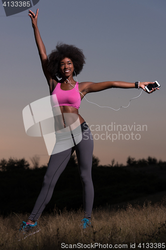 Image of black woman is doing stretching exercise relaxing and warm up